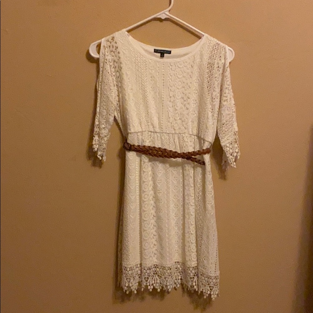 White lace dress with cold shoulders and a belt
